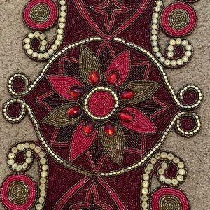 Intricate Beaded Textile with Red and Gold Accents